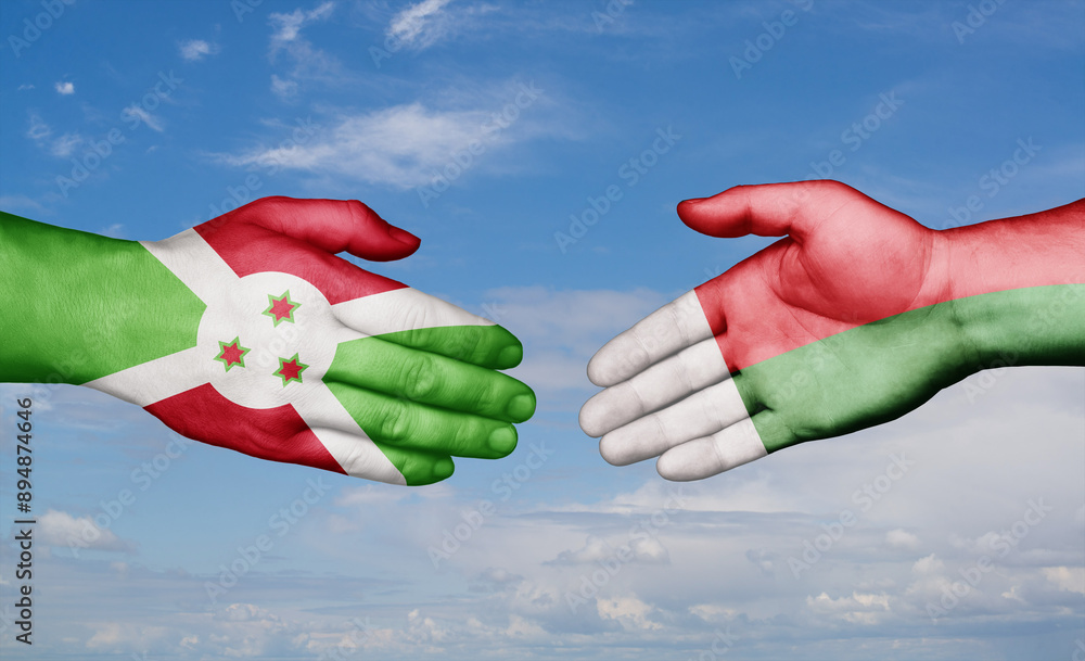 Madagascar and Burundi country handshaking with flags, consensus concept international co-operation illustration Madagascar and Burundi country handshaking with flags, consensus concept international co-operation illustration