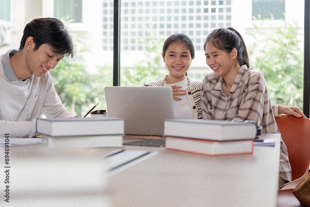 Group of Happy Students Studying Together with Laptops and Books in a Bright Modern Classroom Group of Happy Students Studying Together with Laptops and Books in a Bright Modern Classroom
