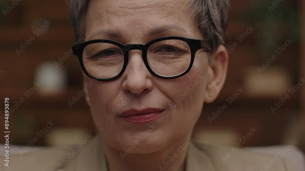 A senior woman wearing eyeglasses displays a look of doubt, captured in a close-up portrait that highlights her thoughtful and contemplative expression A senior woman wearing eyeglasses displays a look of doubt, captured in a close-up portrait that highlights her thoughtful and contemplative expression