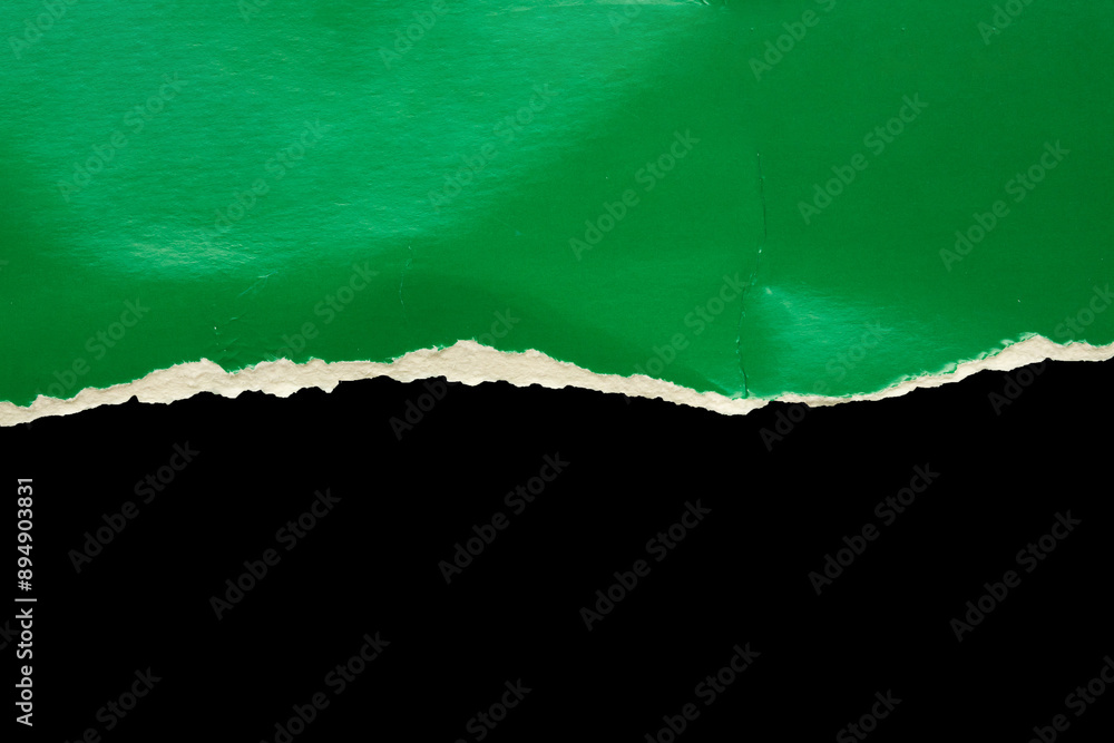Green ripped paper torn edges strips isolated on black background Green ripped paper torn edges strips isolated on black background