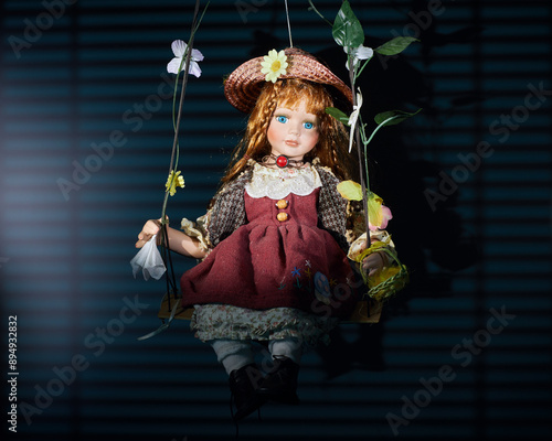 Doll on swing on