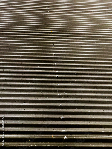 background of a black corrugated sheet metal roof.. Building materials
