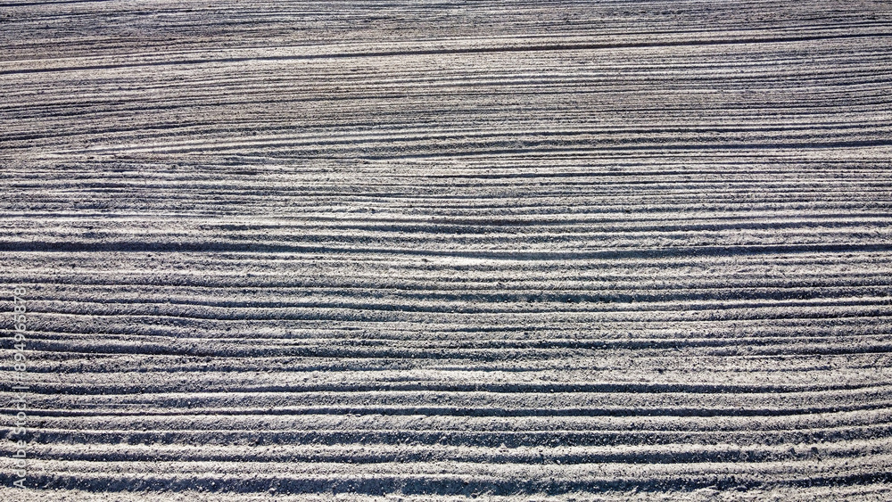 Plowed agricultural field, aerial view. Agricultural land. Background. Plowed agricultural field, aerial view. Agricultural land. Background.