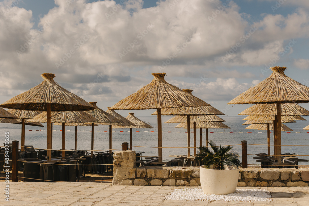 Empty beach near the old town of Budva, Montenegro. Beautiful sunny morning. Empty beach near the old town of Budva, Montenegro. Beautiful sunny morning.