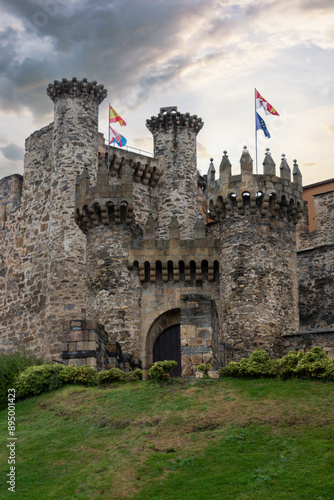 Принти на полотні Medieval fortress architecture with moss-covered stone walls and battlements on a cloudy day