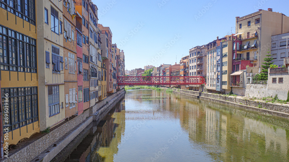 Girona, Spain - 23 July, 2024: Colored houses on River Onyar, Girona, Catalonia Girona, Spain - 23 July, 2024: Colored houses on River Onyar, Girona, Catalonia