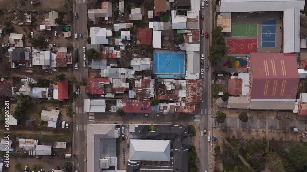 Aerial birds-eye view of San José de Maipo showing town buildings and sports courts. A beautiful depiction of urban architecture and community facilities. Aerial birds-eye view of San José de Maipo showing town buildings and sports courts. A beautiful depiction of urban architecture and community facilities.