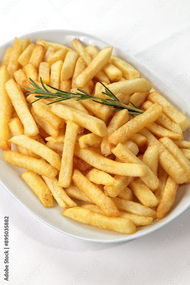 French fries in bowl seen from above on white background French fries in bowl seen from above on white background