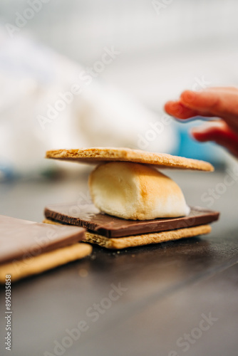 Close-up of a s'more being assembled photo