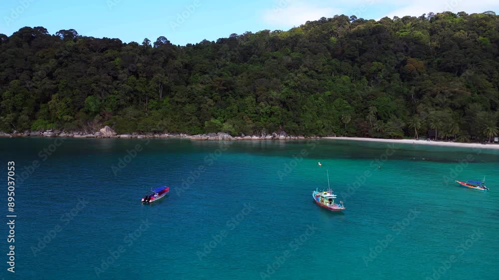 Boats are anchored in the turquoise, healthy reef clear blue water off the coast of a tropical island paradise. Perfect aerial view flight overflight flyover drone Boats are anchored in the turquoise, healthy reef clear blue water off the coast of a tropical island paradise. Perfect aerial view flight overflight flyover drone