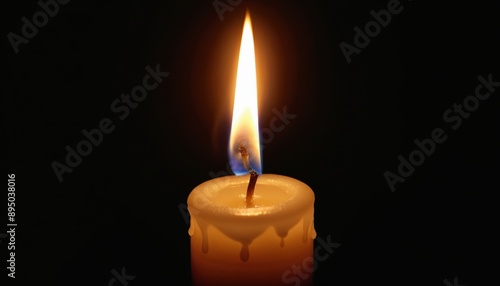 A single lit candle casting a warm glow in the darkness.