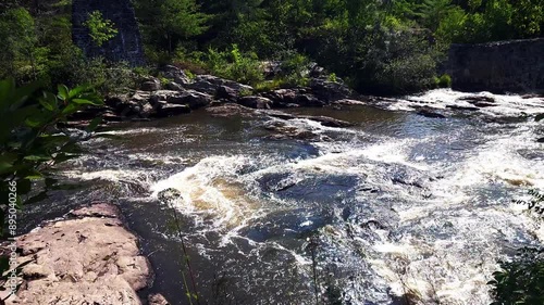 Royal River showing remnants of old woolen mill in Yarmouth, Maine photo