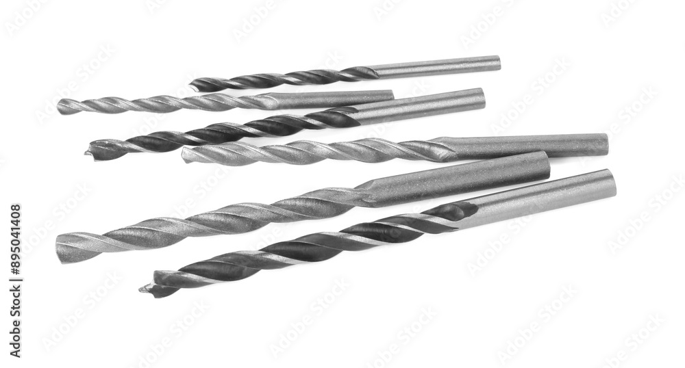 Many different drill bits isolated on white Many different drill bits isolated on white