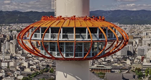 Kyoto Japan Aerial v78 drone flyover Higashishiokojicho around the landmark tower capturing panoramic views of downtown cityscape and mountain ranges - Shot with Mavic 3 Pro Cine - October 2023 photo