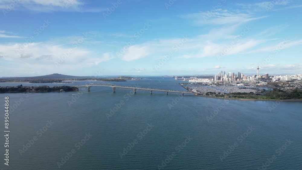 Auckland CBD And Marina With Auckland Harbour Bridge In Foreground. Waitemata Harbour, North Island, New Zealand. drone sideways shot Auckland CBD And Marina With Auckland Harbour Bridge In Foreground. Waitemata Harbour, North Island, New Zealand. drone sideways shot