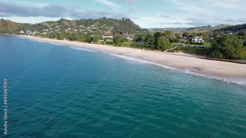 Sandy Shore Of Hahei Beach Walk At Coromandel Peninsula Coast, Mercury Bay In North Island, New Zealand. Aerial Pullback Shot Sandy Shore Of Hahei Beach Walk At Coromandel Peninsula Coast, Mercury Bay In North Island, New Zealand. Aerial Pullback Shot