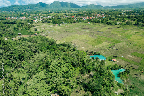 Aerial view of sulphur lakes, farmland and lush vegetation on an island in North Sulawesi, Indonesia photo