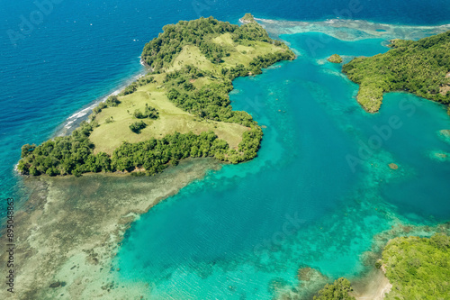 Exotic natural beauty of the Molucca Sea and lush vegetation at Borgo Satu in North Sulawesi, Indonesia; Borgo Satu, Belang, Southeast Minahasa Regency, North Sulawesi, Indonesia photo