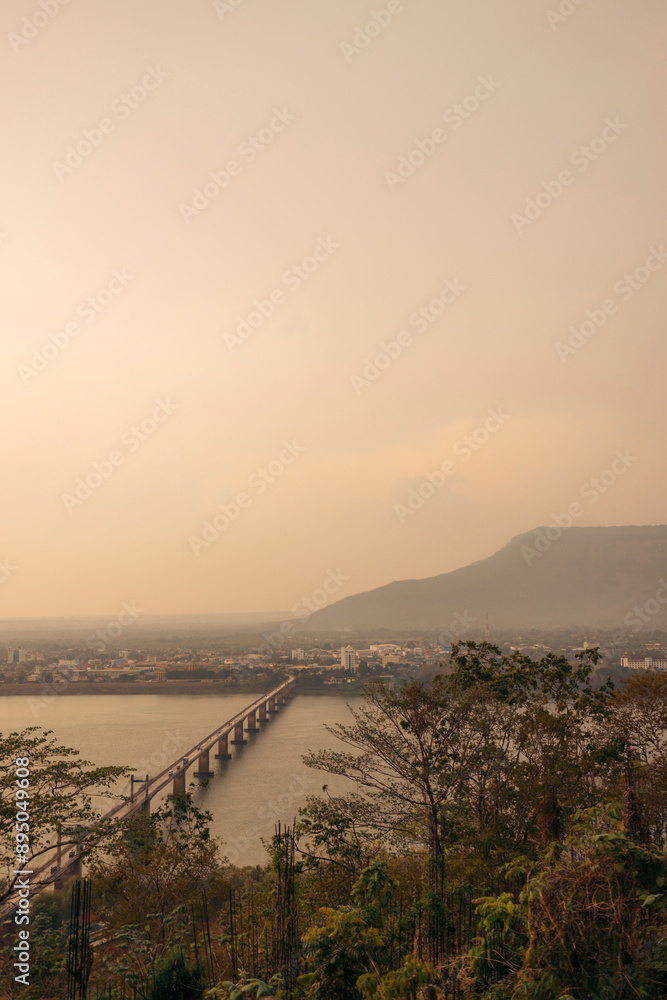 Bridge over the Mekong River at twilight viewed from Wat Phousalao, Laos; Pakse, Laos Bridge over the Mekong River at twilight viewed from Wat Phousalao, Laos; Pakse, Laos