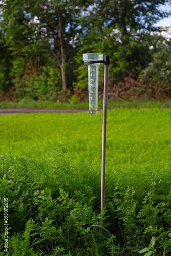 Rain gauge for agricultural use in a field with carrots