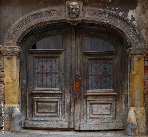 Old wooden door of ancient abandoned architecture in Zagreb, Croatia. 