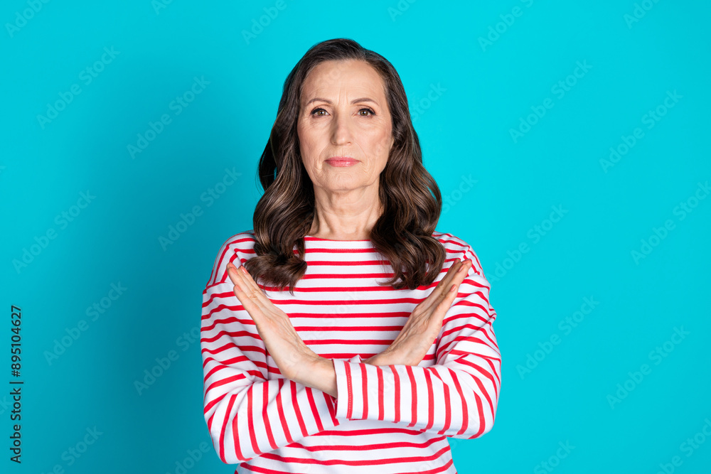 Photo of nice aged woman crossed arms wear pullover isolated on teal color background Photo of nice aged woman crossed arms wear pullover isolated on teal color background