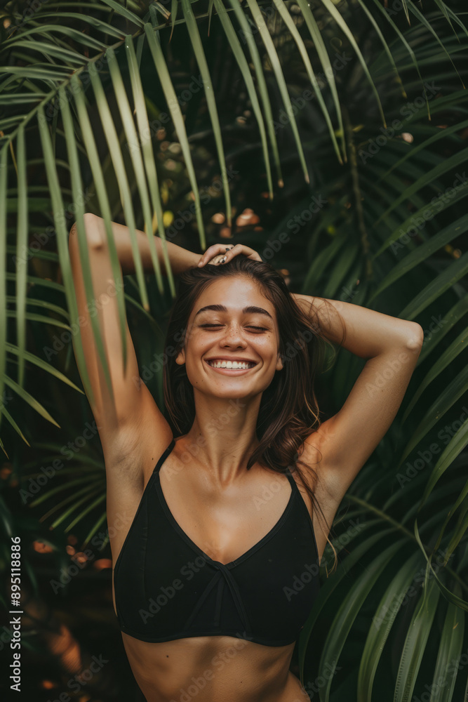 Smiling woman in black bikini enjoying sunlight in lush tropical foliage. Female embracing serene and joyful moment in nature Smiling woman in black bikini enjoying sunlight in lush tropical foliage. Female embracing serene and joyful moment in nature