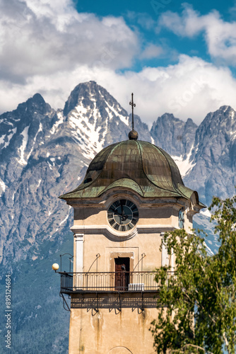 Tower of church of St. Egidius in town Poprad, SLovakia and High Tatras mountains at background