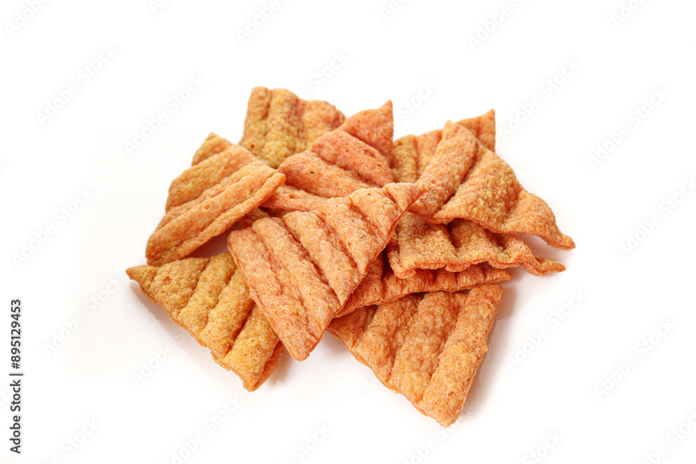 Stack of triangle shaped lentil chips snack isolated on white background. Stack of triangle shaped lentil chips snack isolated on white background.