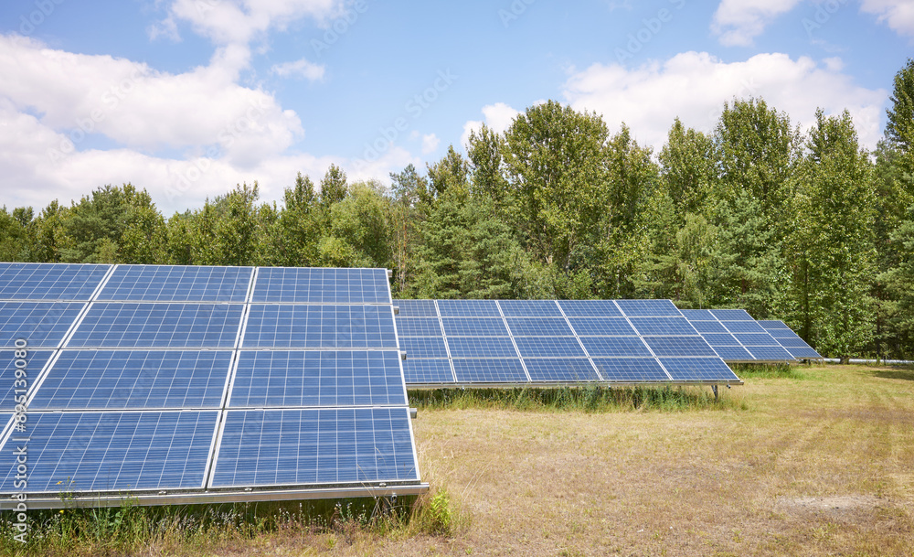 Photo of photovoltaic panels in a field, selective focus. Photo of photovoltaic panels in a field, selective focus.