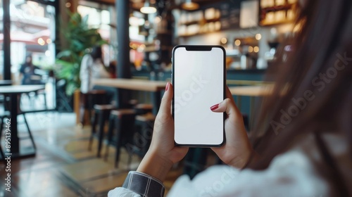 woman using cell phone in coffee shop