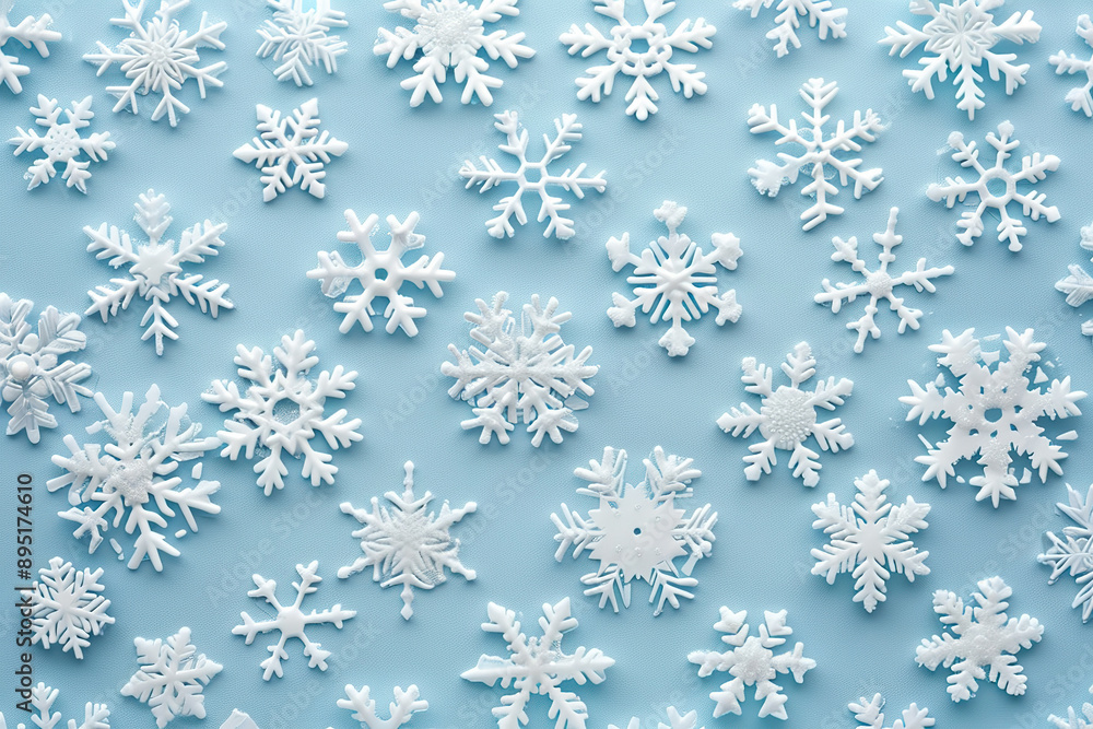 A blue background with a large number of white snowflakes scattered across it. A blue background with a large number of white snowflakes scattered across it.