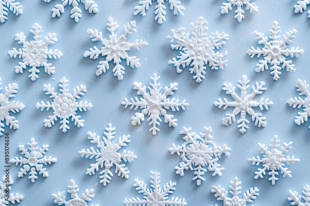 A blue background with a large number of white snowflakes scattered across it. A blue background with a large number of white snowflakes scattered across it.