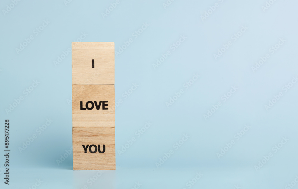 Wooden cubes with inscriptions I Love You on a blue background Wooden cubes with inscriptions I Love You on a blue background