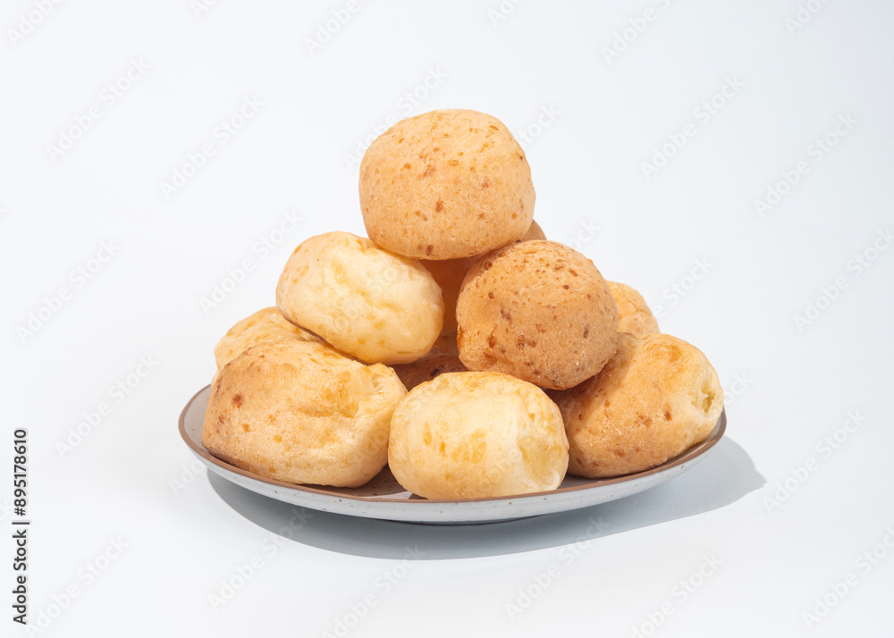 stack of Cheese bread on the plate, Brazilian pao de queijo mineiro, white background stack of Cheese bread on the plate, Brazilian pao de queijo mineiro, white background