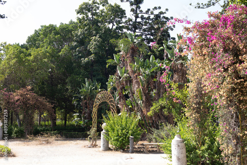 A lush garden with a stone ...