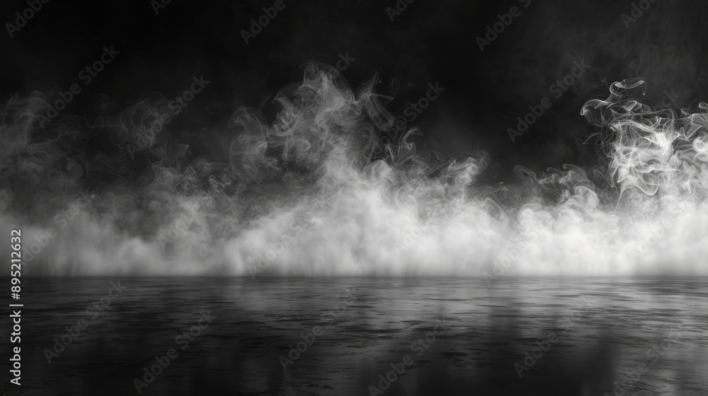 Fototapeta premium A captivating studio scene featuring thick, white smoke wafting over a reflective black surface, set against a completely black background.