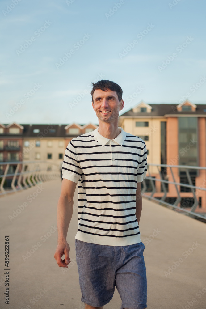 joyful cheerful middle-aged man in nature on a warm sunny day joyful cheerful middle-aged man in nature on a warm sunny day