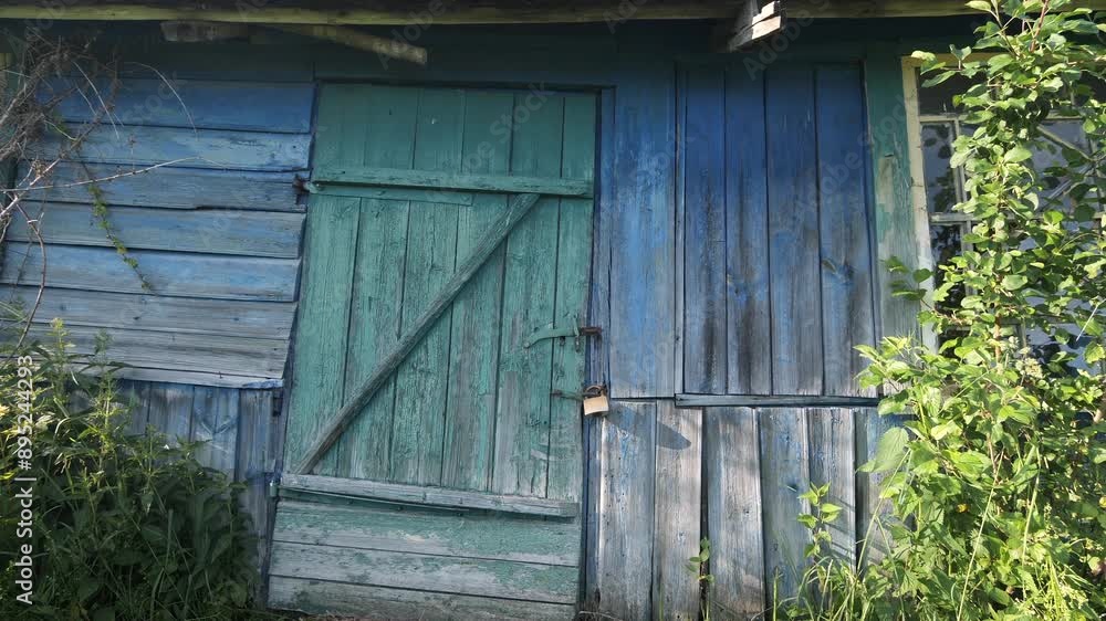Old house padlocked. Locked front door. abandoned wooden house Old house padlocked. Locked front door. abandoned wooden house