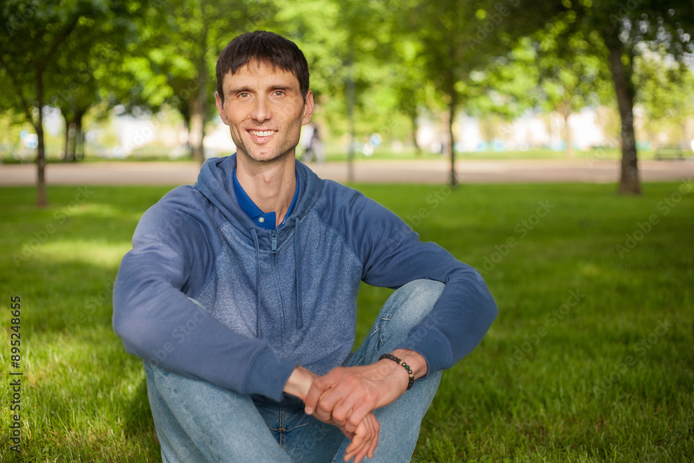 joyful cheerful middle-aged man in nature on a warm sunny day joyful cheerful middle-aged man in nature on a warm sunny day