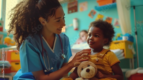 In a vibrant pediatric ward, a cheerful nurse is happily engaging with a child who is clutching a teddy bear