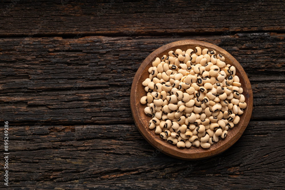 Alubia carilla - Organic black-eyed peas in the wooden bowl Alubia carilla - Organic black-eyed peas in the wooden bowl