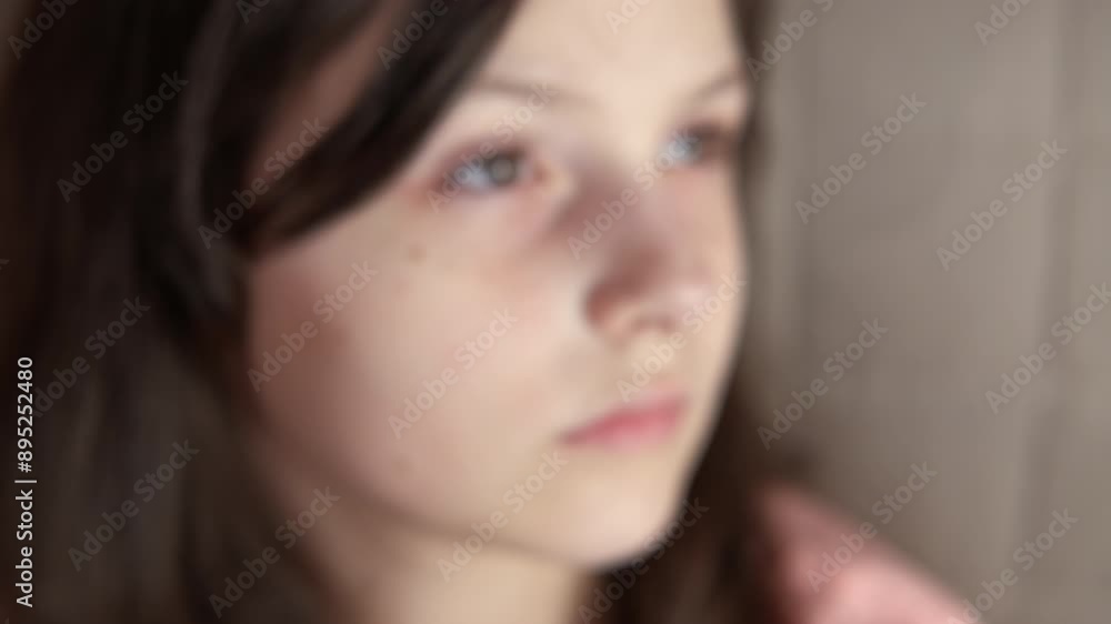 Delighted girl with freckles on cheeks. A joyful child show her freckles on her face indoor. Delighted girl with freckles on cheeks. A joyful child show her freckles on her face indoor.
