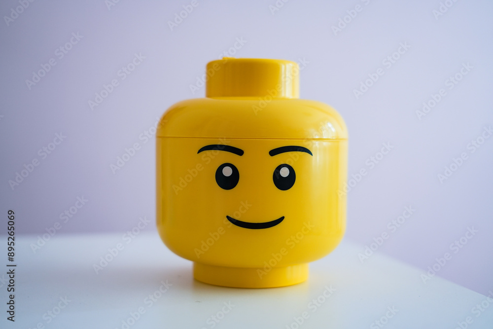 Naklejka premium Yellow Lego Head box on white background, 17 July 2024, Poland. 