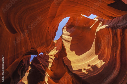 Low angle and summer view of red sandstone wall against blue sky at Antelope Canyon, Arizona, USA
 photo