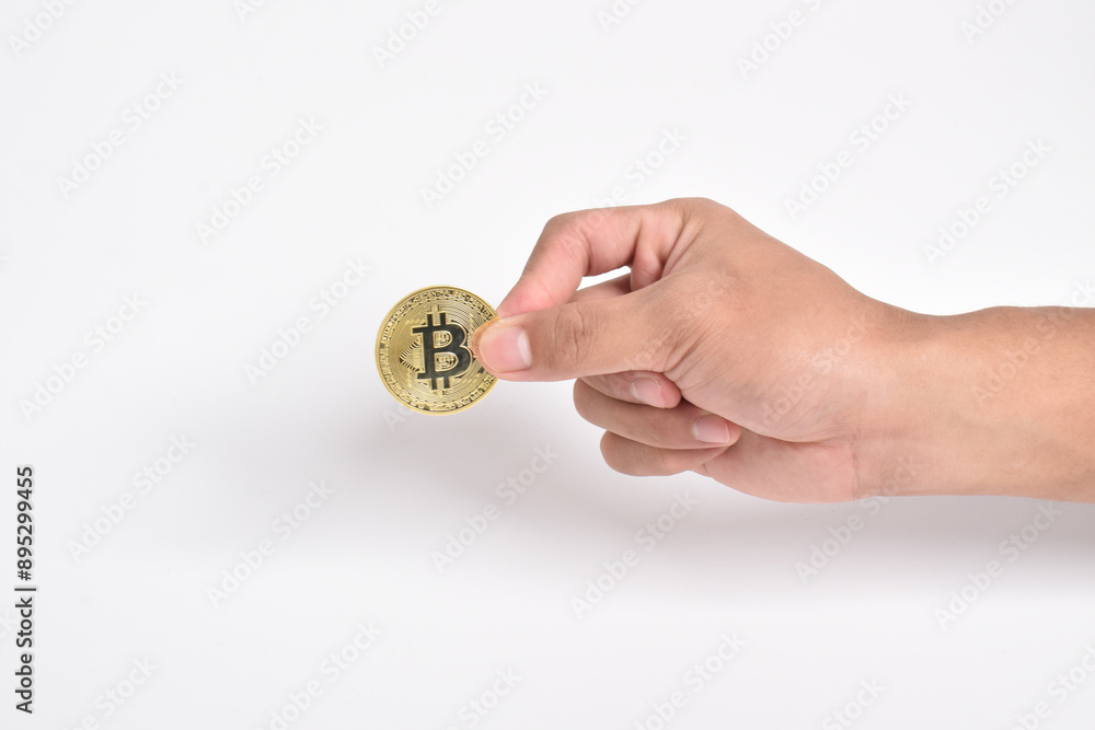 Man's hand holding bitcoin isolated on white background. Copy space. Crypto currency concept. Savings, investments concept. Modern digital method of payment. Clipping path Man's hand holding bitcoin isolated on white background. Copy space. Crypto currency concept. Savings, investments concept. Modern digital method of payment. Clipping path