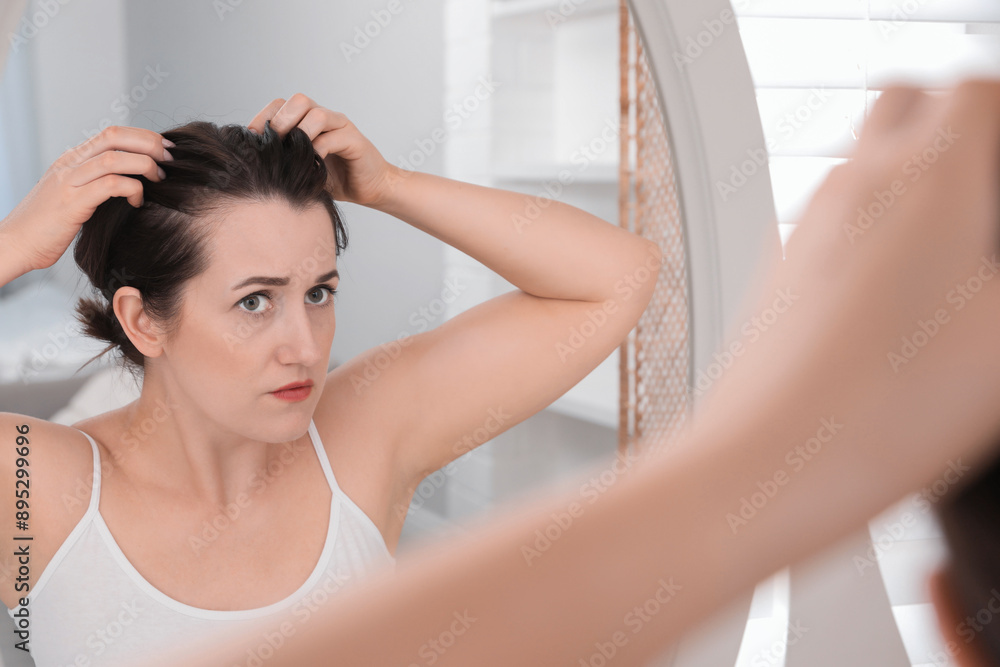 Woman with hair loss problem at home Woman with hair loss problem at home
