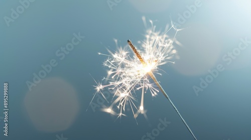 sparkler is lit and is pointing upwards