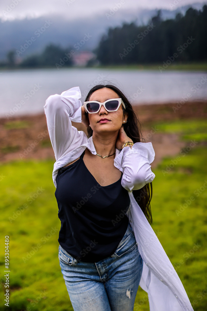 Portrait of a grimacing girl in nature, woods. Mexican Girls, white shirt. Portrait of a grimacing girl in nature, woods. Mexican Girls, white shirt.