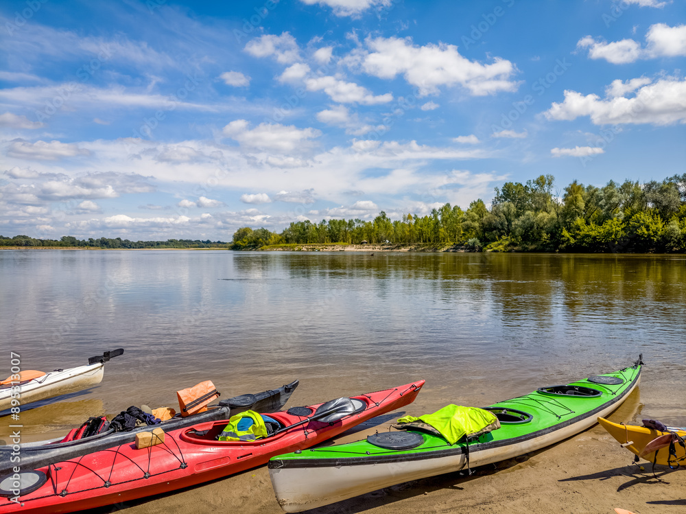 Kayaks taken out on the river beach. Kayaks taken out on the river beach.